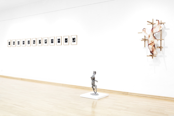 Exhibition view with three art
                                          works